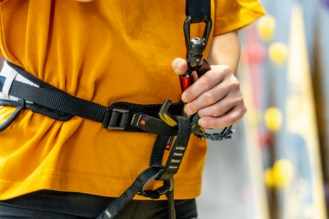CONNECT Climber connecting Perfect Descent Auto Belay to their harness